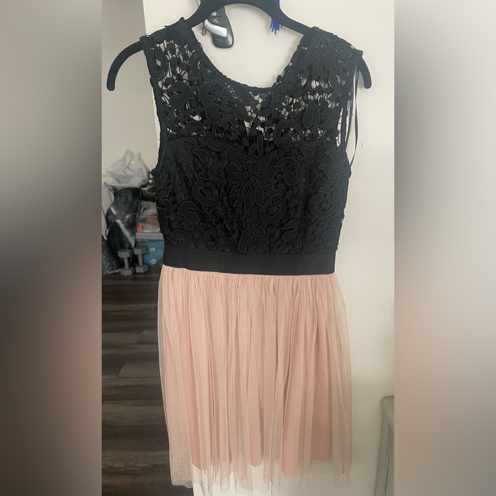 Black and nude lace and tulle bottom. Size Small. Above knee length. NWT